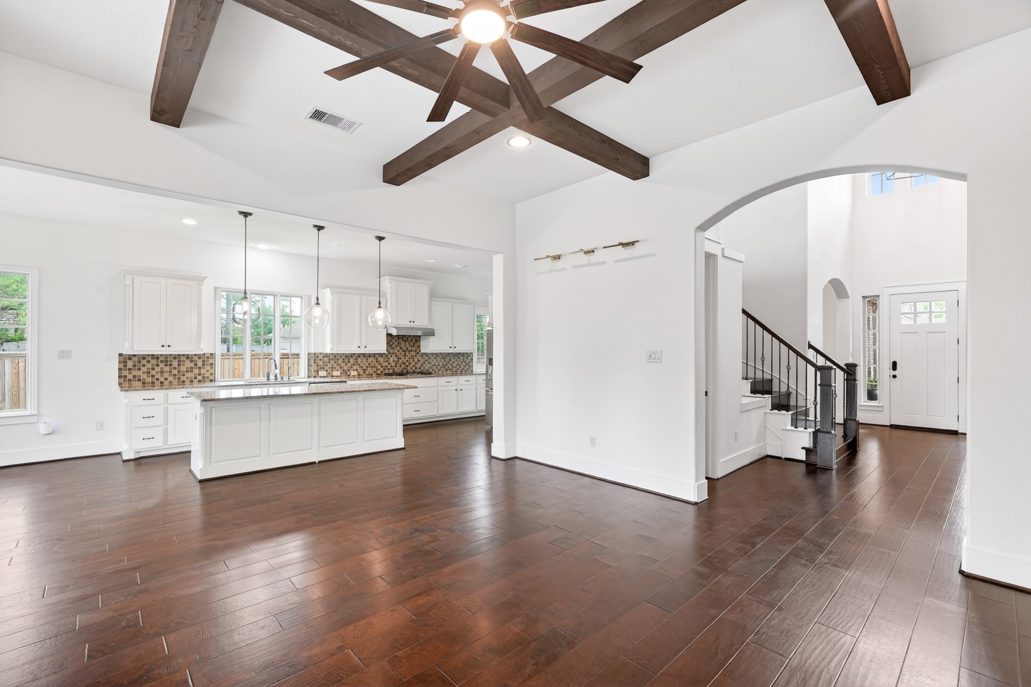 27 Hedgedale Way Spring, TX 77389 - Photo 14 of 49 a view of an empty room with kitchen appliances and a ceiling fan