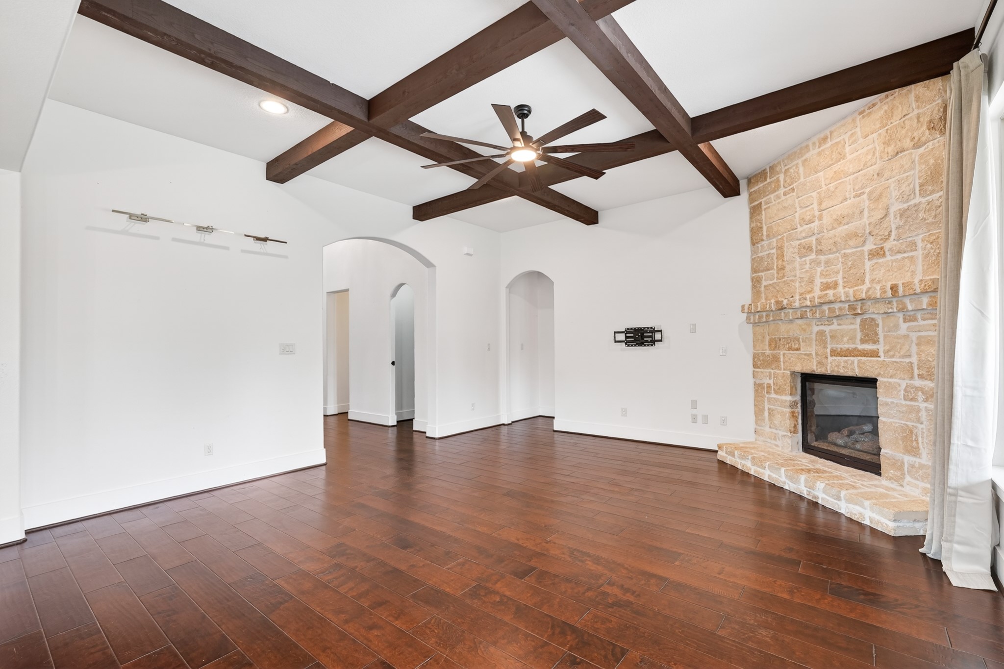 27 Hedgedale Way Spring, TX 77389 - Photo 15 of 49 wooden floor in an empty room with a fireplace