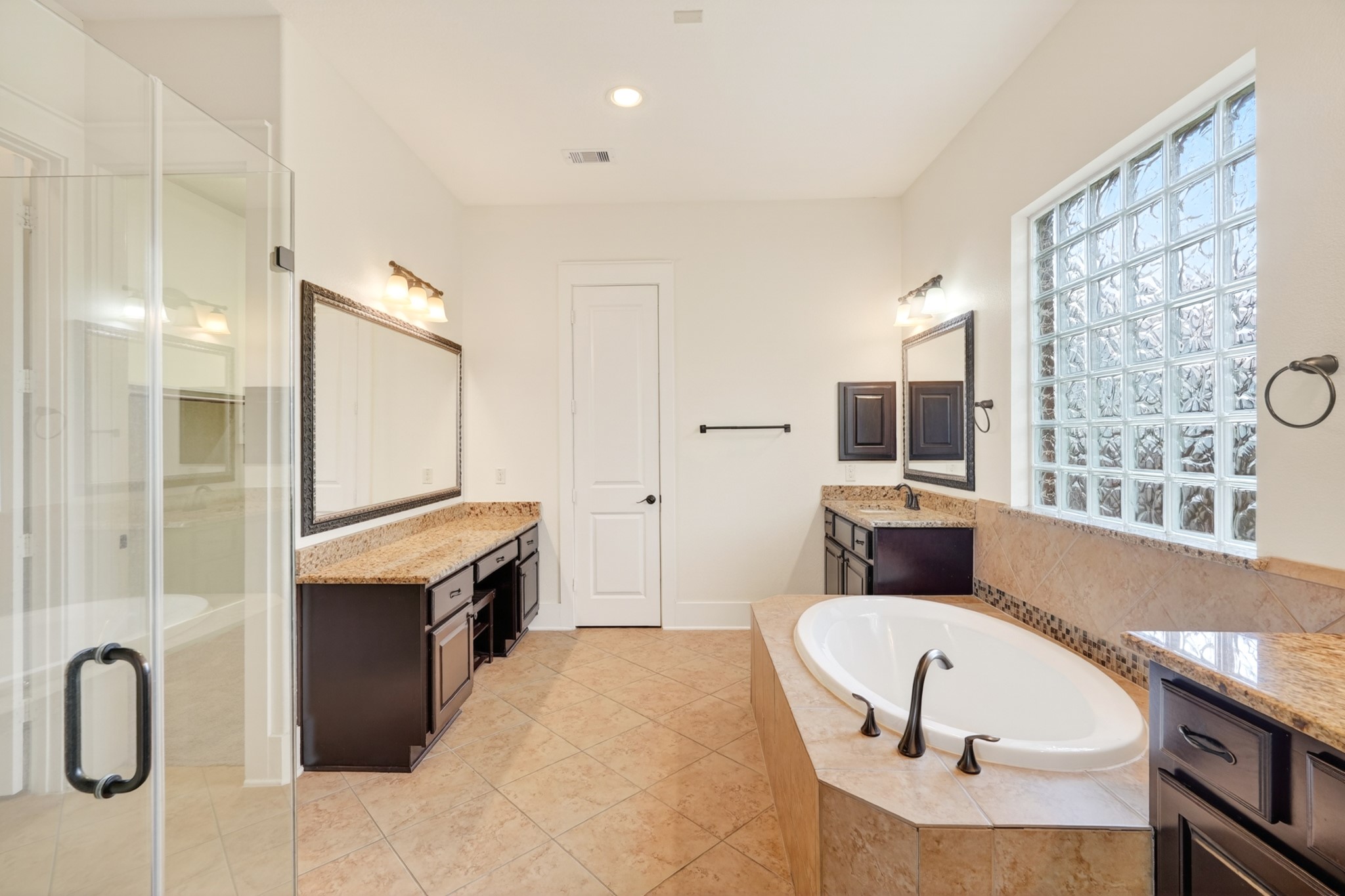 27 Hedgedale Way Spring, TX 77389 - Photo 24 of 49 a large bathroom with a tub a sink and a large window
