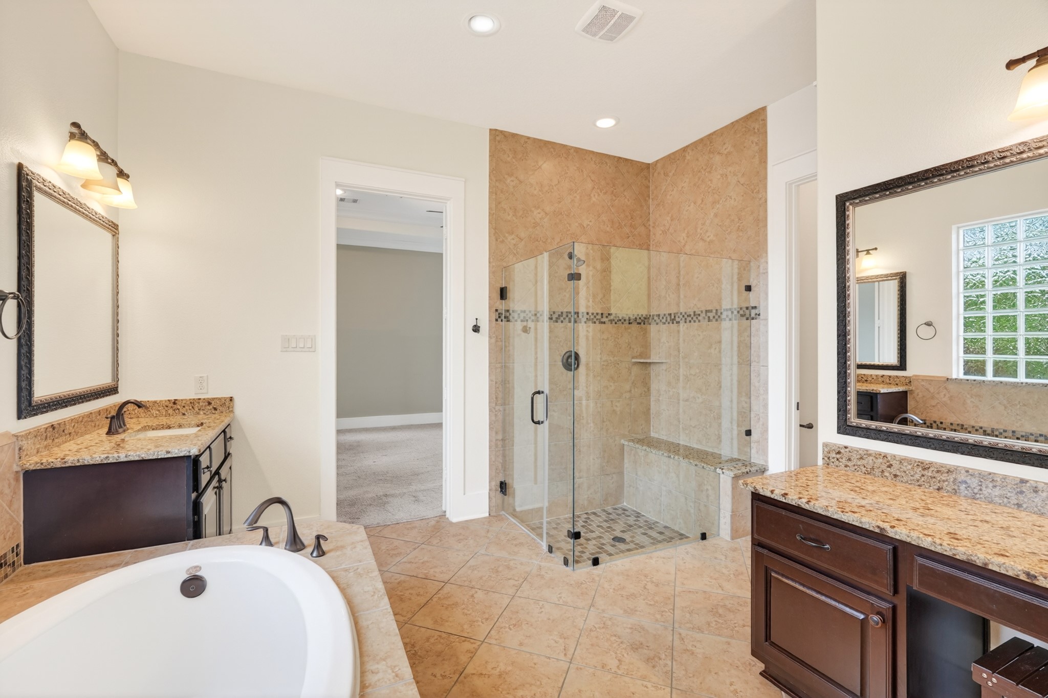 27 Hedgedale Way Spring, TX 77389 - Photo 25 of 49 a bathroom with a granite countertop double vanity sink mirror and shower
