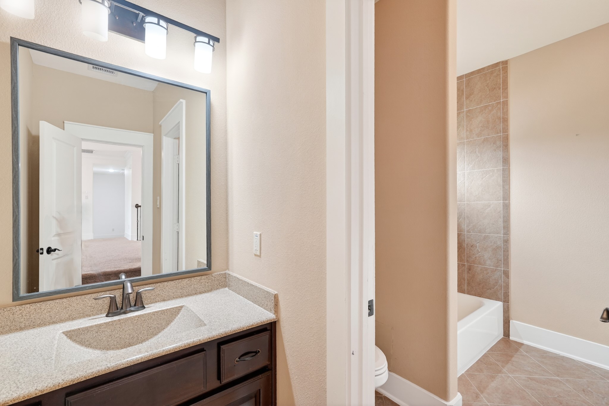 27 Hedgedale Way Spring, TX 77389 - Photo 34 of 49 a bathroom with a sink and a mirror