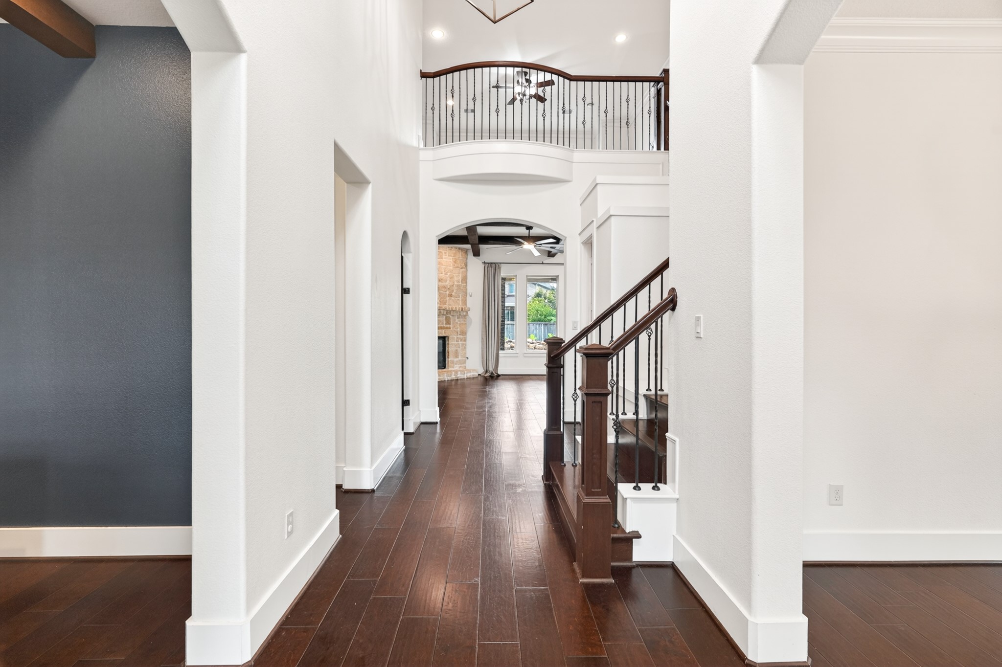 27 Hedgedale Way Spring, TX 77389 - Photo 7 of 49 a view of a hallway with wooden floor and staircase