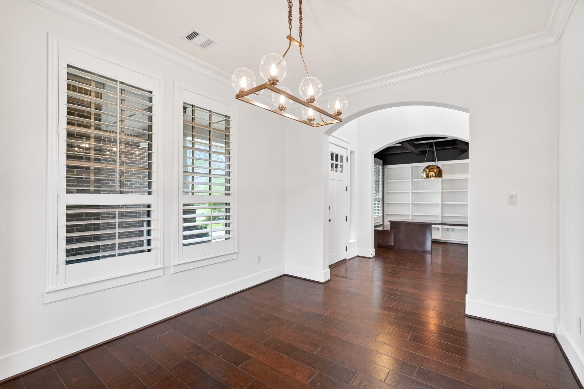 27 Hedgedale Way Spring, TX 77389 - Photo 9 of 49 a view of an empty room with a window and wooden floor