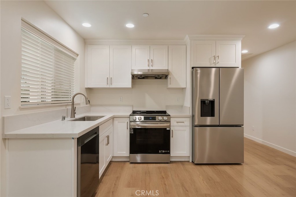 1806 South 8th Street, Unit B Alhambra, CA 91803 - Photo 16 of 44 a kitchen with a stove sink and refrigerator