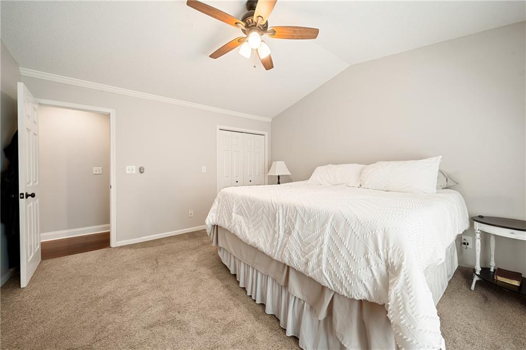 921 Pace Road Hiram, GA 30141 - Photo 17 of 41 a bedroom with a bed and a ceiling fan