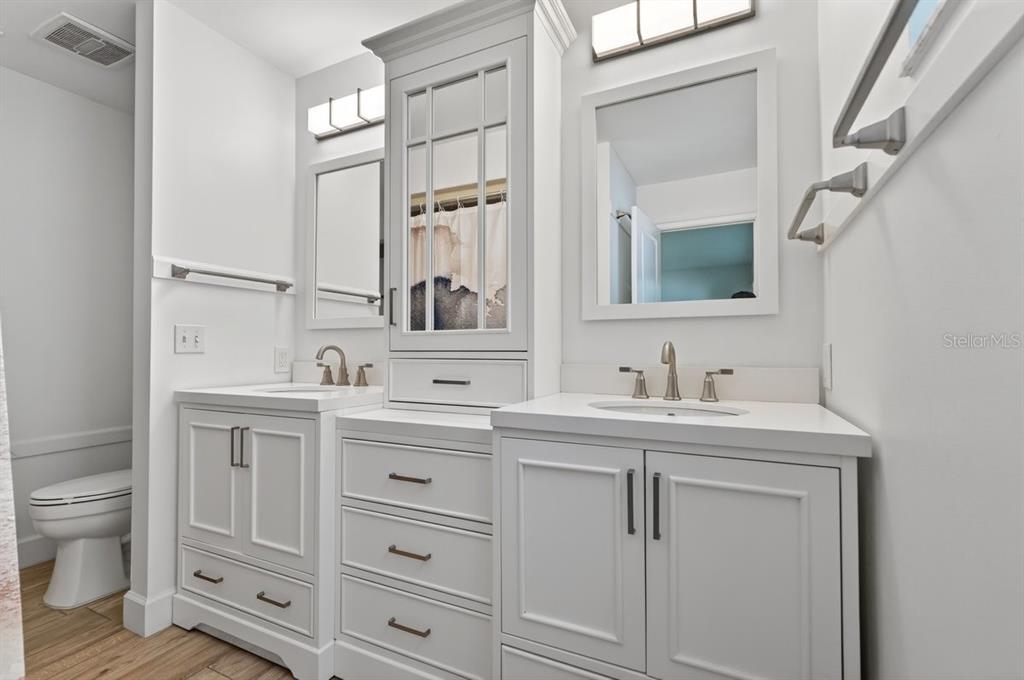 171 William Street Edgewater, FL 32141 - Photo 21 of 40 a spacious bathroom with a granite countertop sink and a mirror