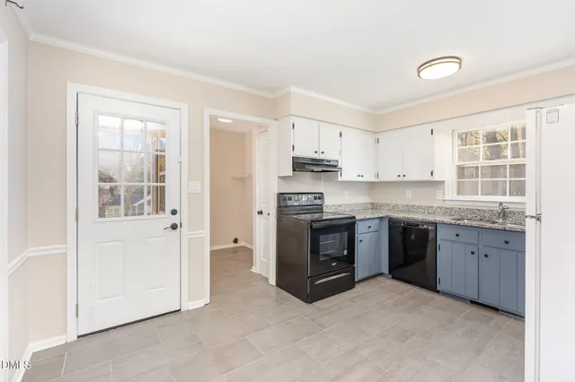a kitchen with stainless steel appliances granite countertop a stove and a refrigerator