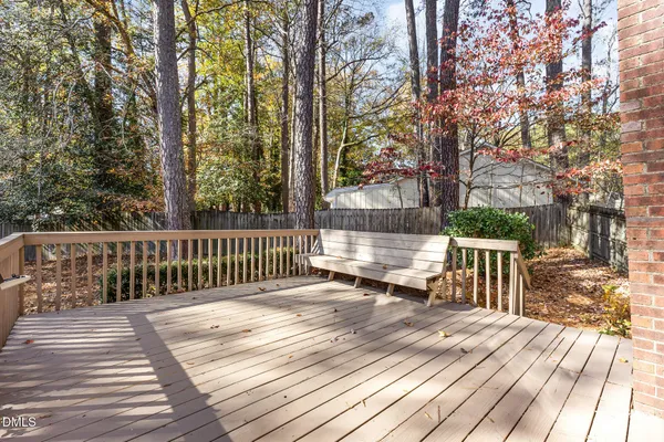 a view of backyard with deck and wooden floor