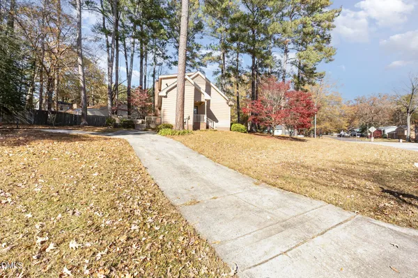a view of a yard with trees