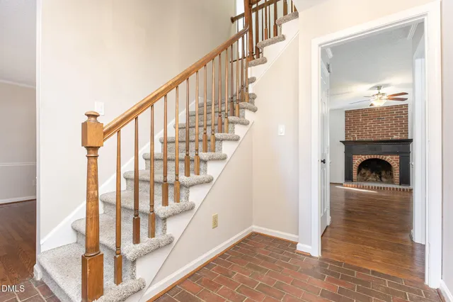 a view of entryway and hall with wooden floor