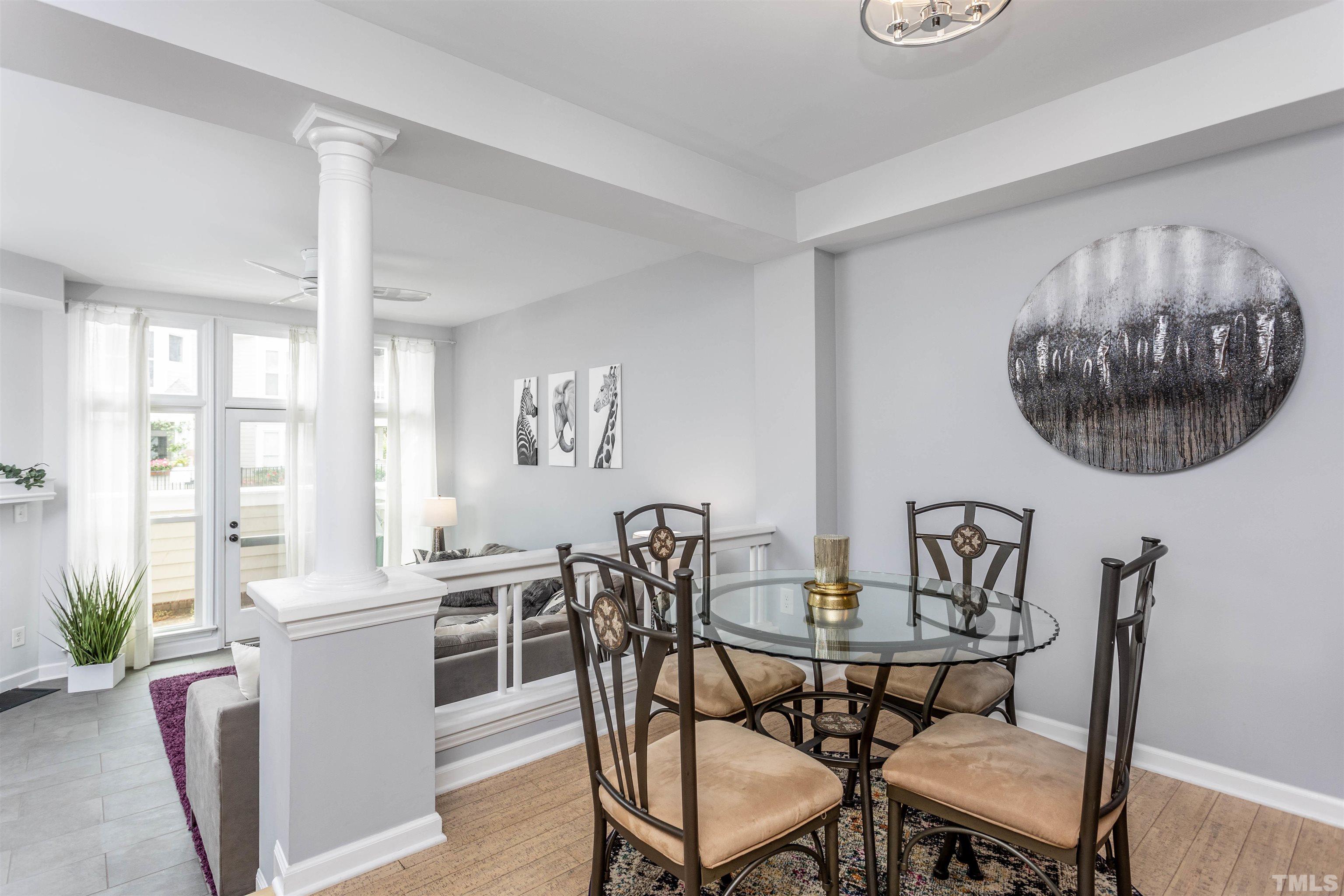 1024 Brighthurst Drive, Unit 1024 Raleigh, NC 27605 - Photo 11 of 30 a view of a dining room with furniture and chandelier