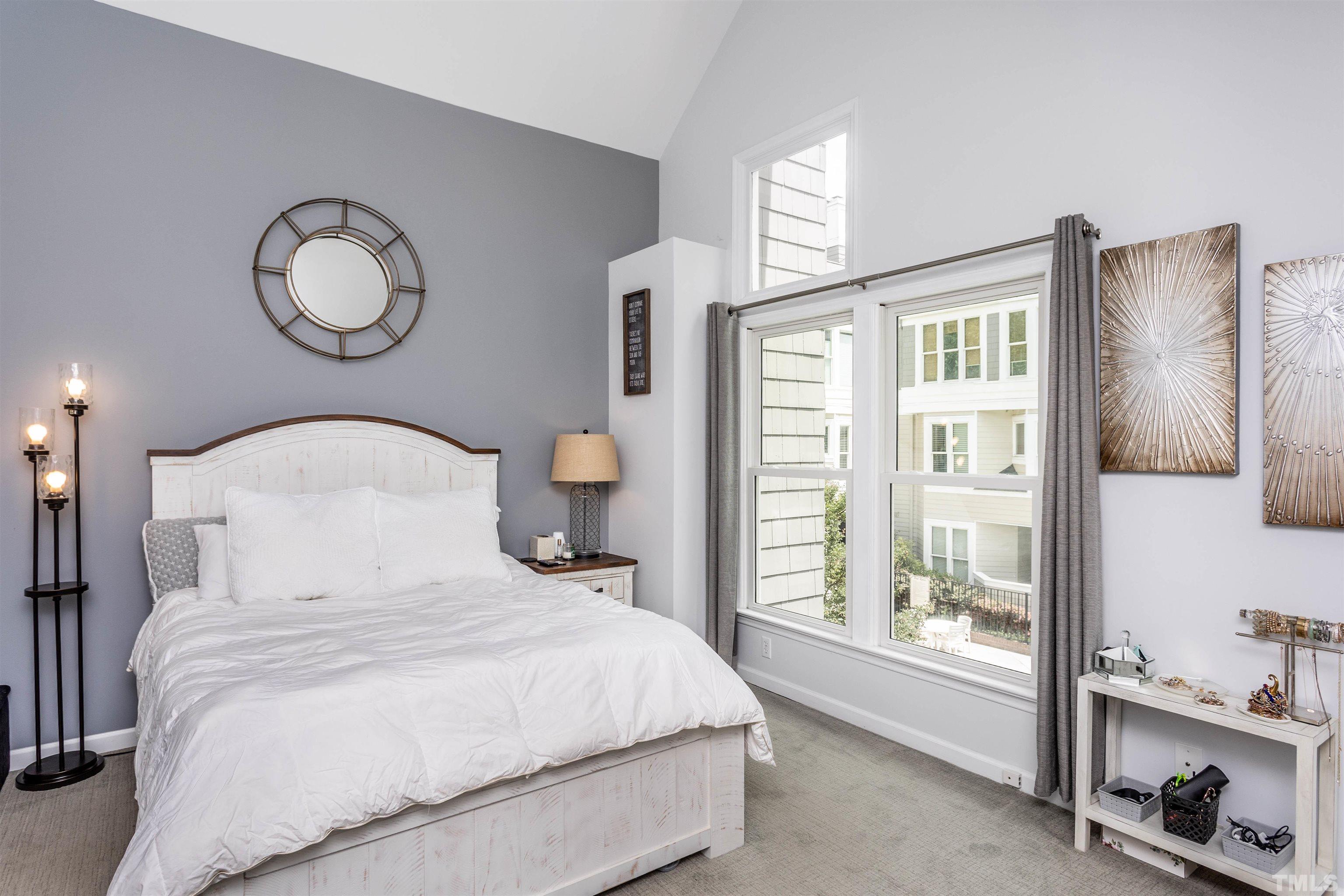 1024 Brighthurst Drive, Unit 1024 Raleigh, NC 27605 - Photo 17 of 30 a bedroom with a large bed and a window