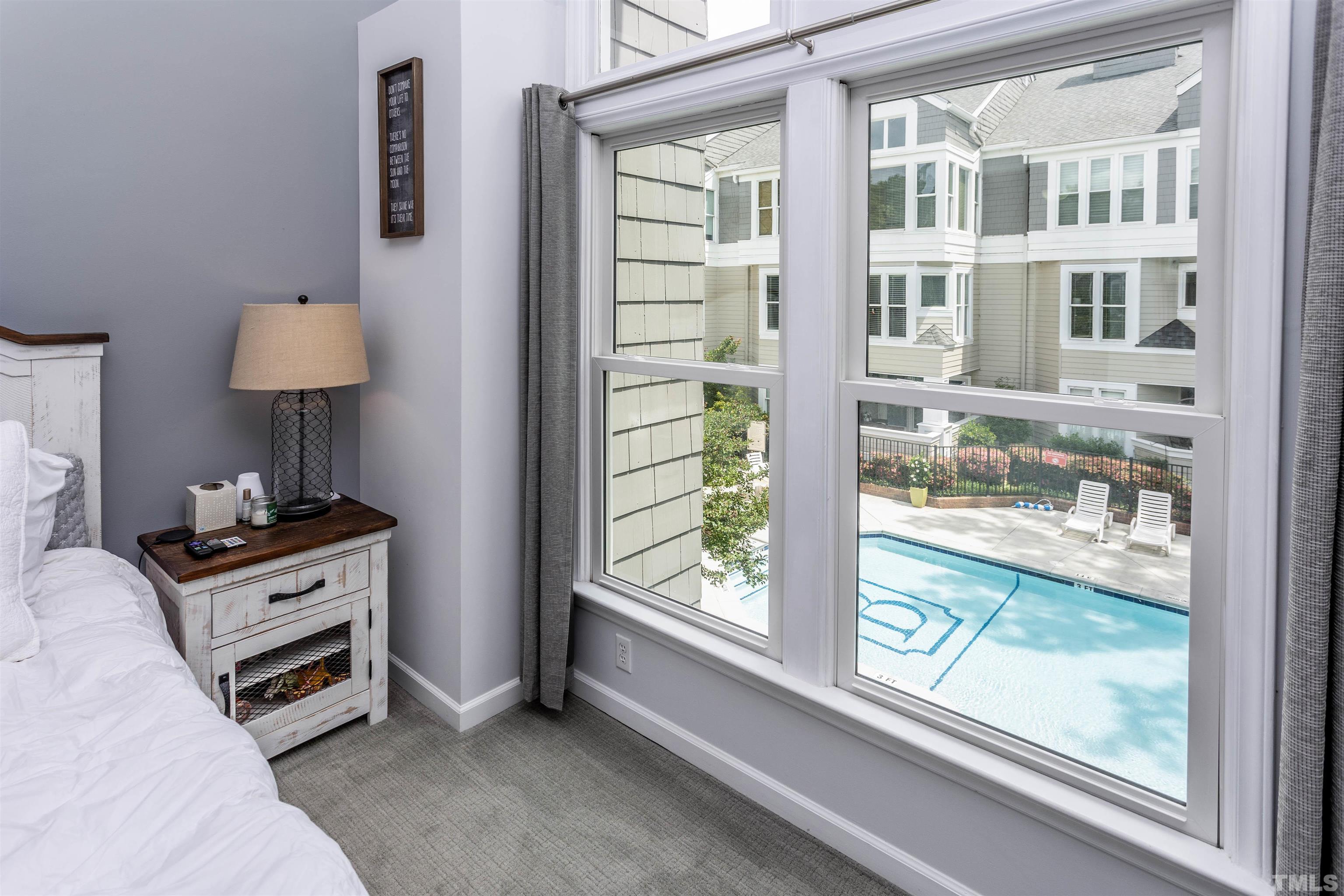 1024 Brighthurst Drive, Unit 1024 Raleigh, NC 27605 - Photo 19 of 30 a bedroom with furniture and a window