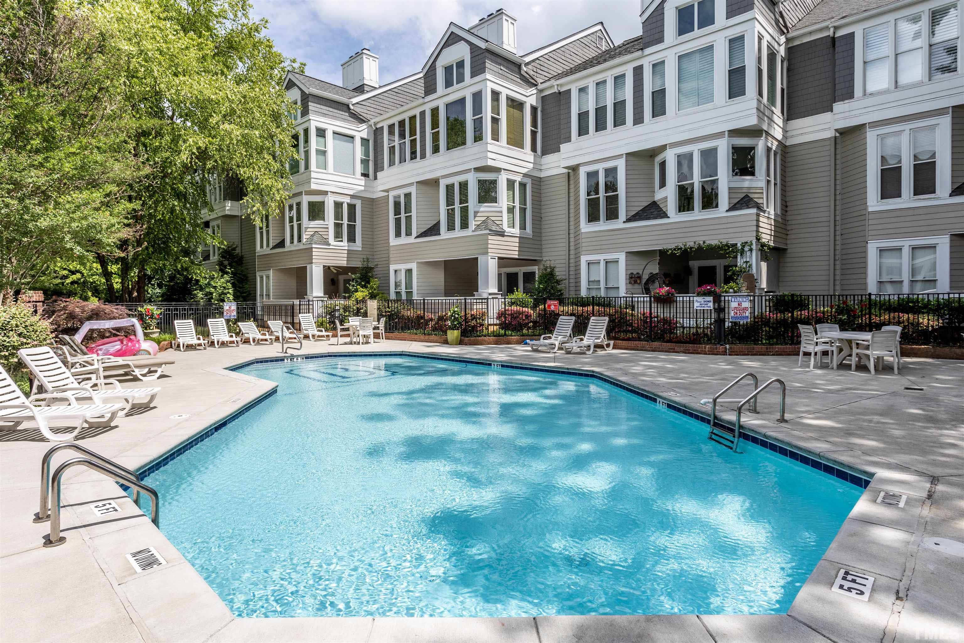 1024 Brighthurst Drive, Unit 1024 Raleigh, NC 27605 - Photo 27 of 30 a swimming pool view with a outdoor seating