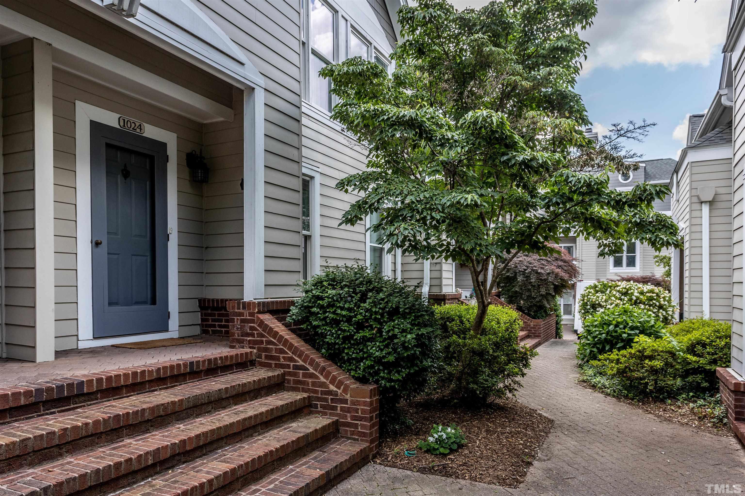 1024 Brighthurst Drive, Unit 1024 Raleigh, NC 27605 - Photo 30 of 30 a front view of a house with plants