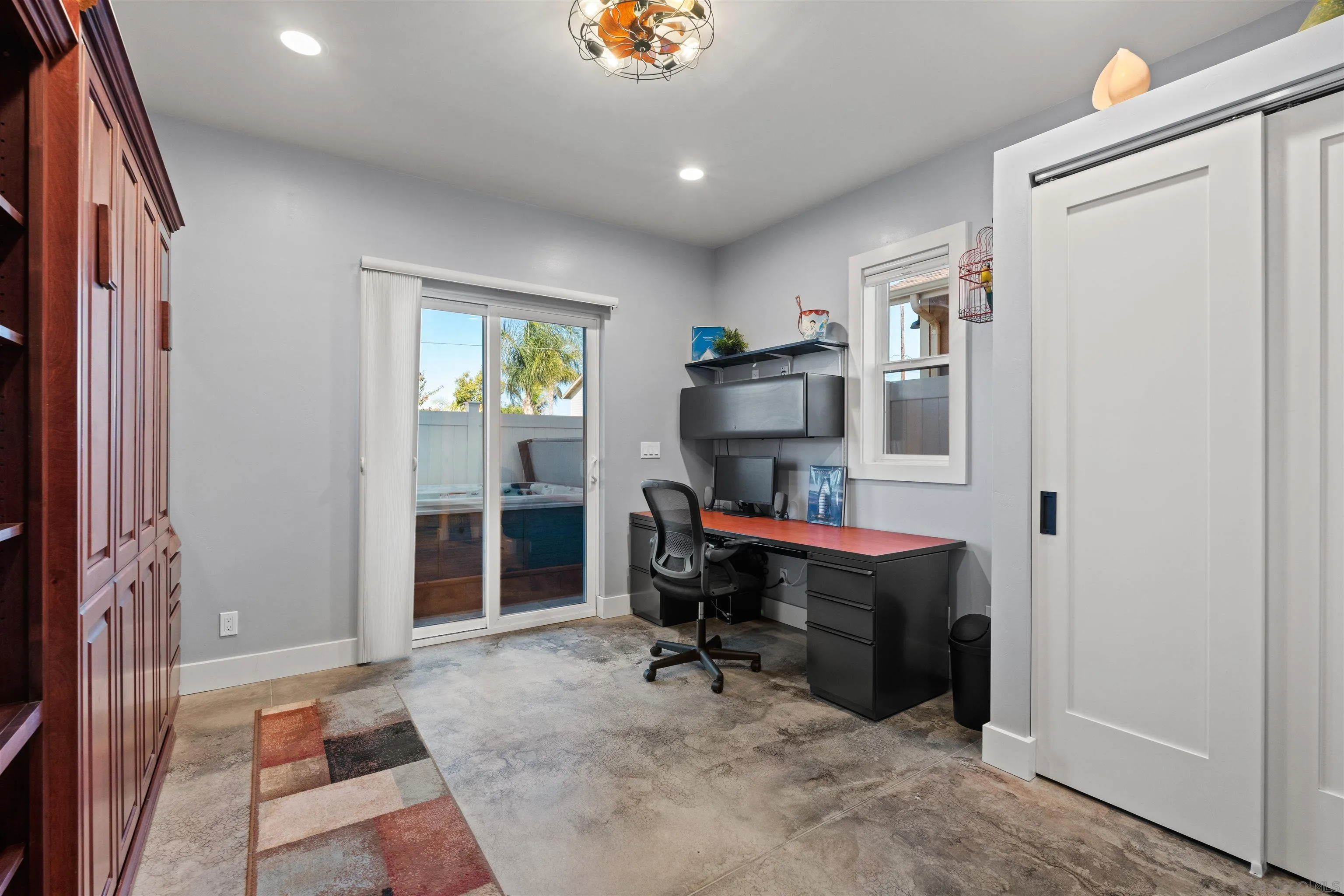 413 Delaware Street Imperial Beach, CA 91932 - Photo 11 of 37 a view of a workspace with furniture and window