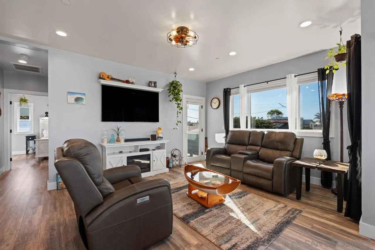 413 Delaware Street Imperial Beach, CA 91932 - Photo 20 of 37 a living room with furniture and a flat screen tv