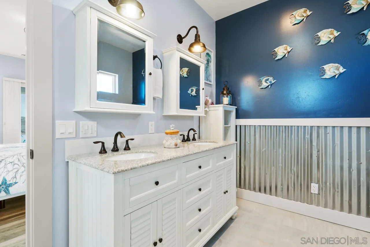 413 Delaware Street Imperial Beach, CA 91932 - Photo 28 of 37 a bathroom with a sink vanity and mirror