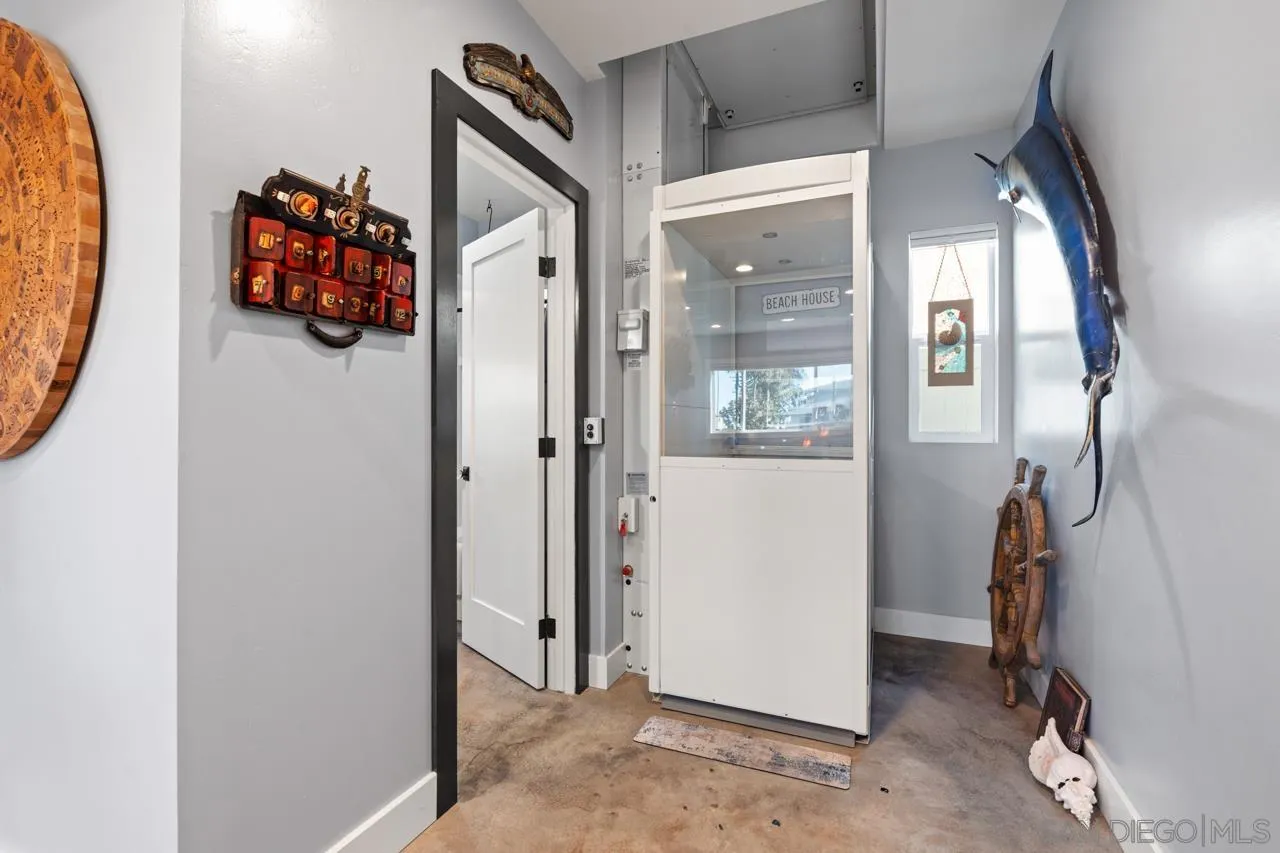 413 Delaware Street Imperial Beach, CA 91932 - Photo 9 of 37 a view of a hallway with wooden floor and windows