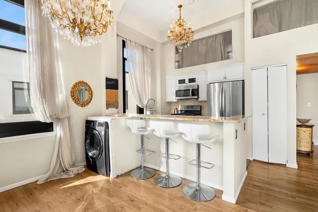 a bathroom with a sink a mirror and a shower