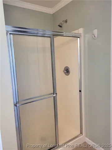 a bathroom with a glass shower door