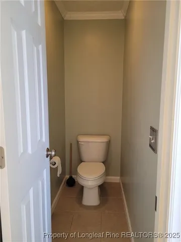a toilet sitting in a bathroom next to a sink