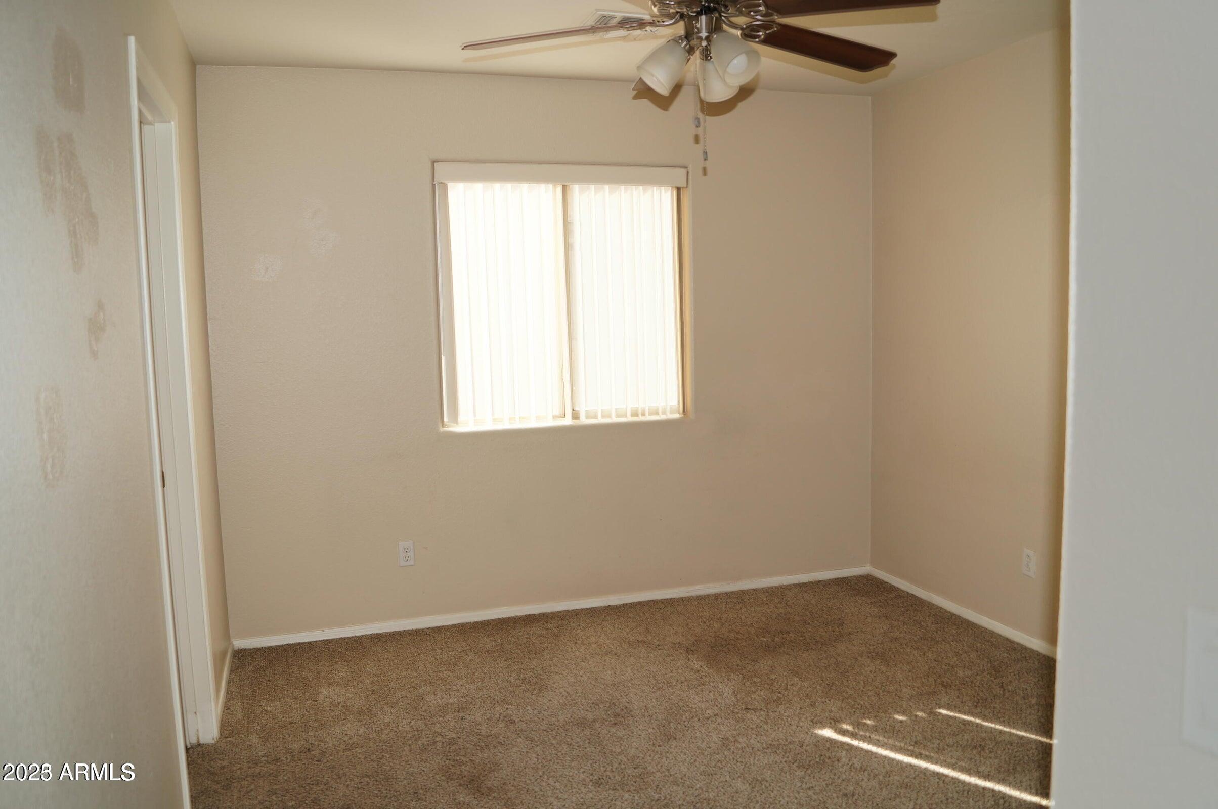 8102 West Hammond Lane Phoenix, AZ 85043 - Photo 14 of 16 an empty room with a window