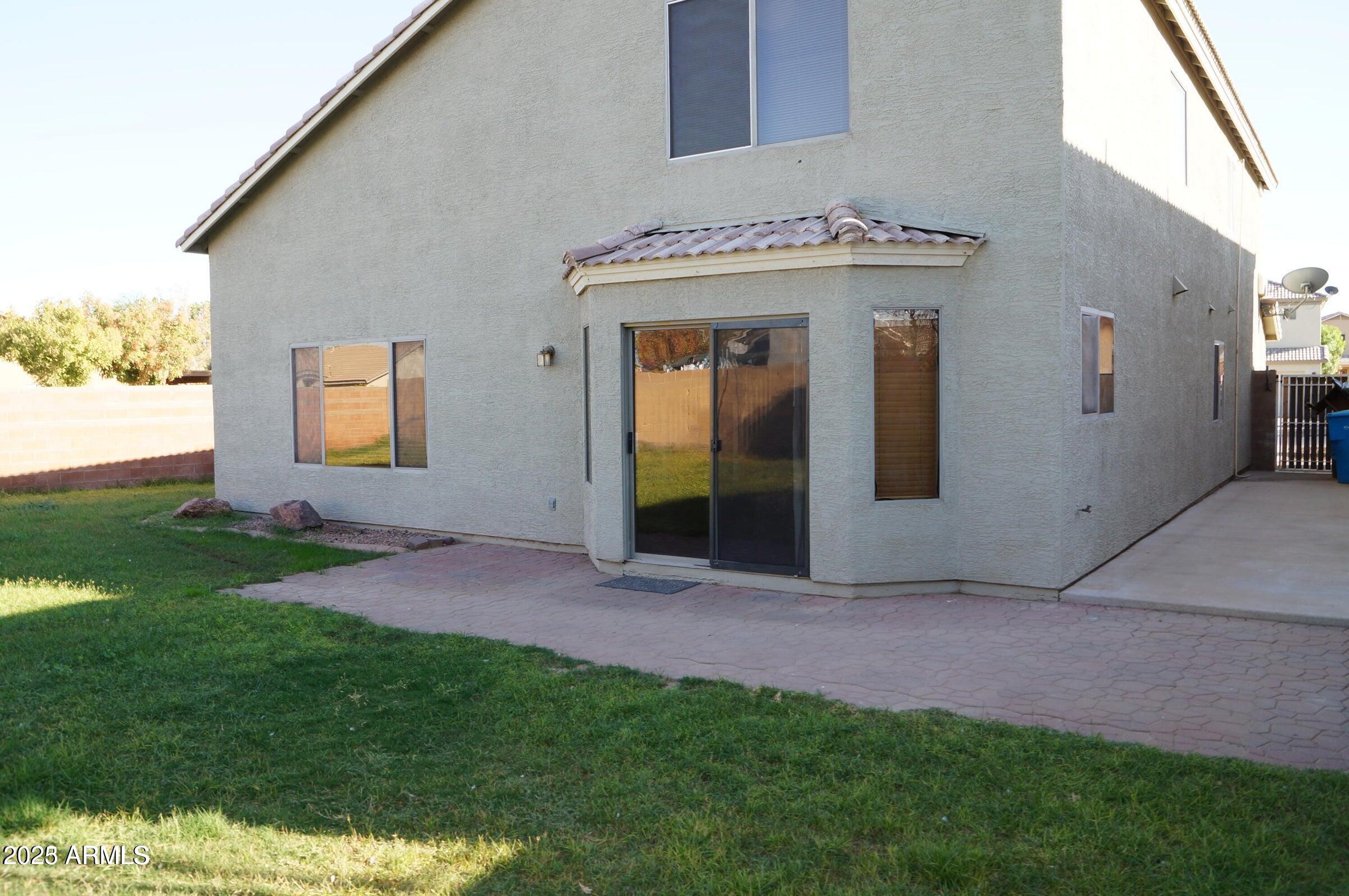 8102 West Hammond Lane Phoenix, AZ 85043 - Photo 15 of 16 a view of a house with a backyard