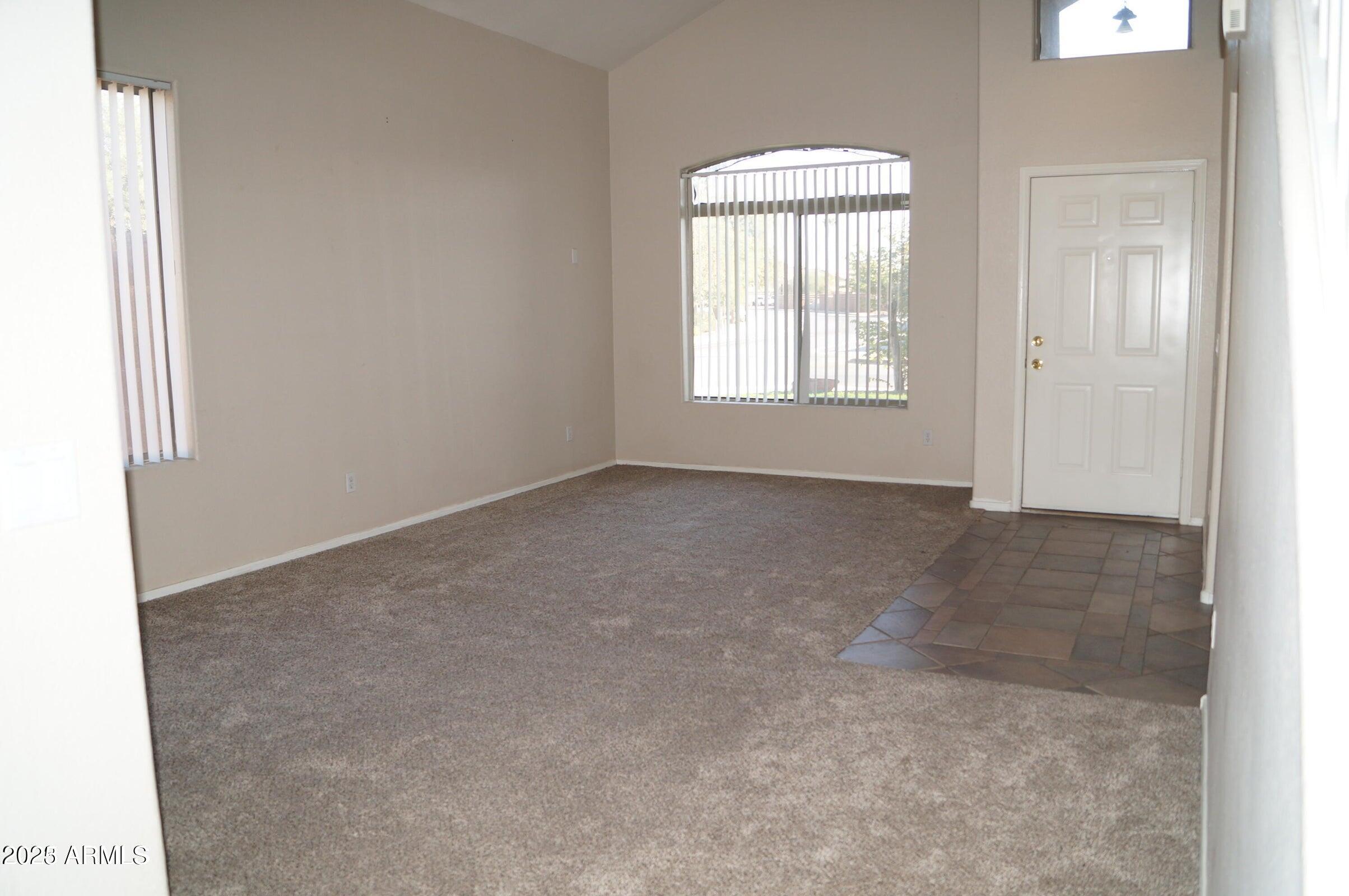 8102 West Hammond Lane Phoenix, AZ 85043 - Photo 2 of 16 an empty room with windows