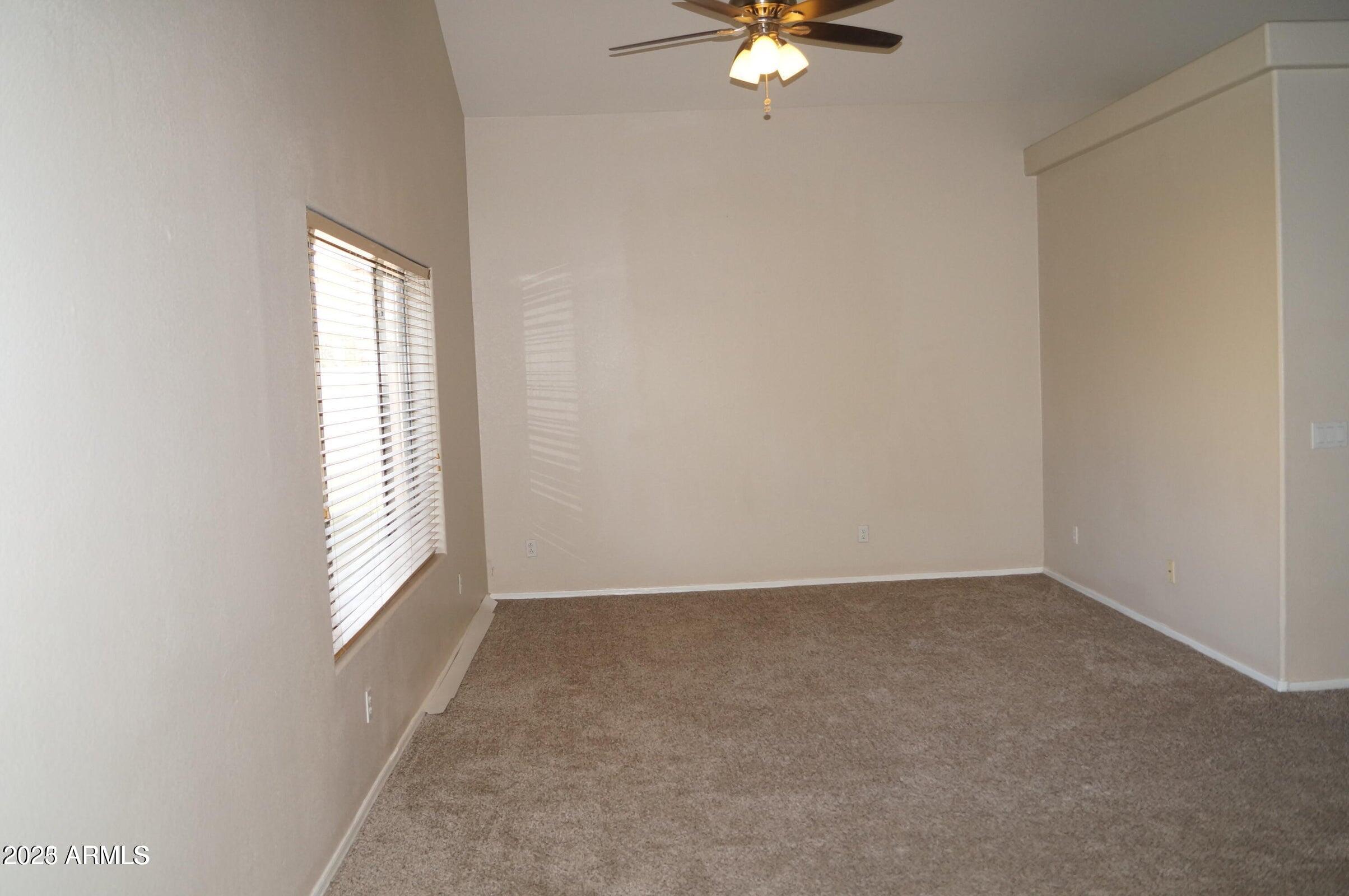 8102 West Hammond Lane Phoenix, AZ 85043 - Photo 4 of 16 an empty room with windows