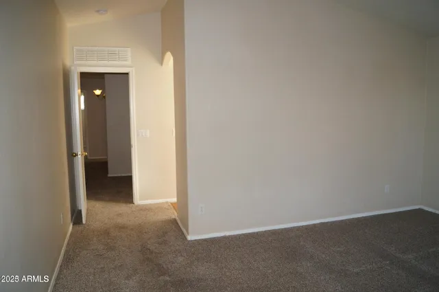 a view of an empty room and closet