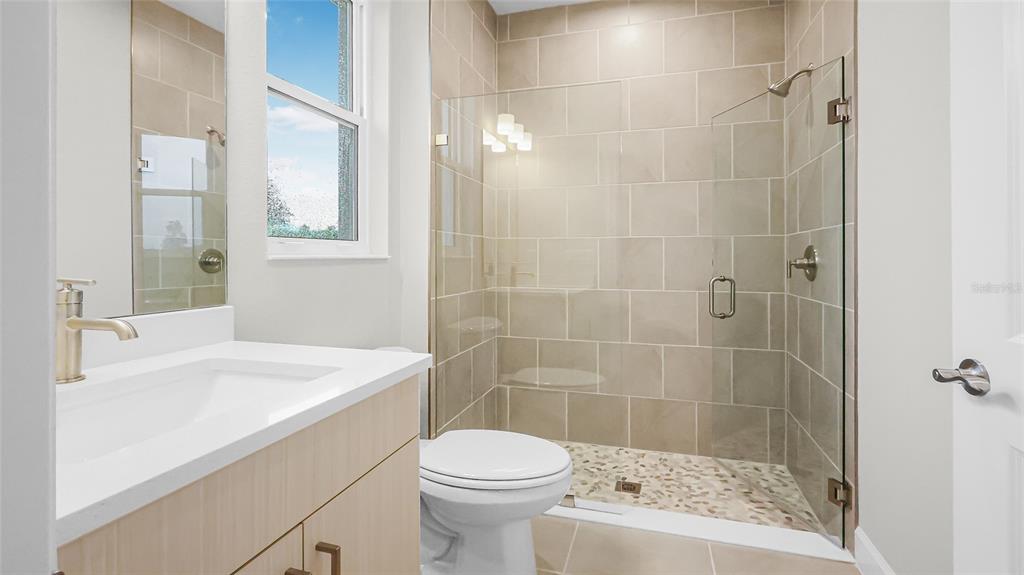 1620 Bellagio Loop Tavares, FL 32778 - Photo 37 of 81 a bathroom with a sink a toilet and shower