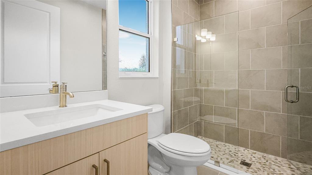 1620 Bellagio Loop Tavares, FL 32778 - Photo 38 of 81 a bathroom with a sink a toilet and shower