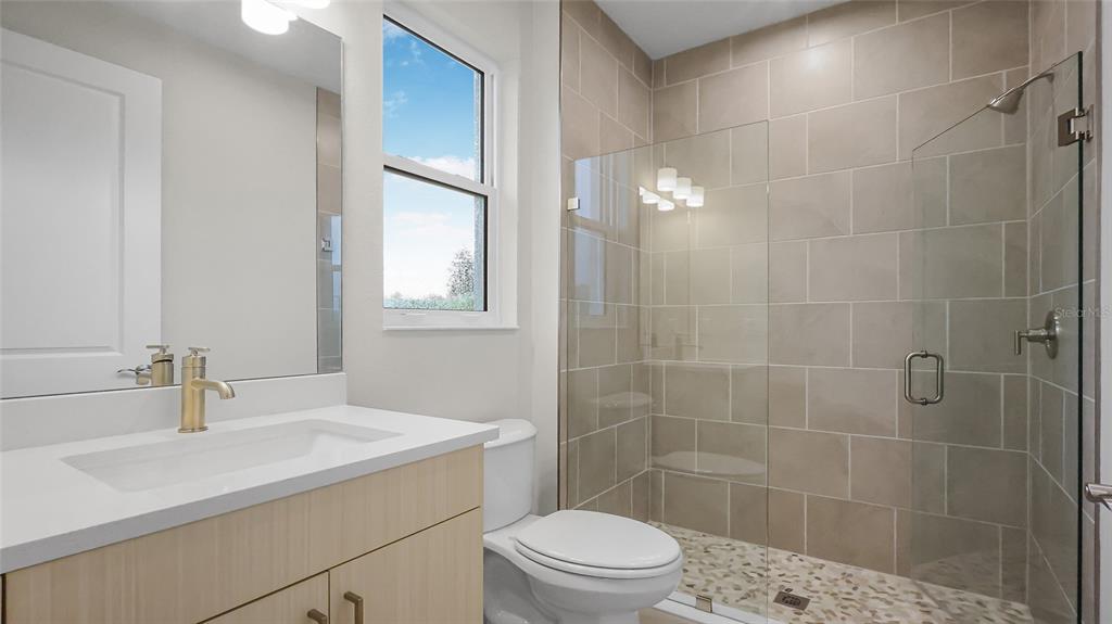1620 Bellagio Loop Tavares, FL 32778 - Photo 39 of 81 a bathroom with a sink a toilet and shower