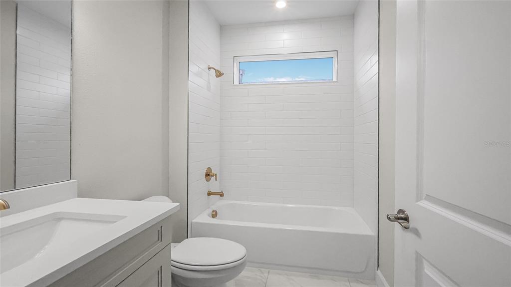 1620 Bellagio Loop Tavares, FL 32778 - Photo 41 of 81 a bathroom with a sink a toilet and shower