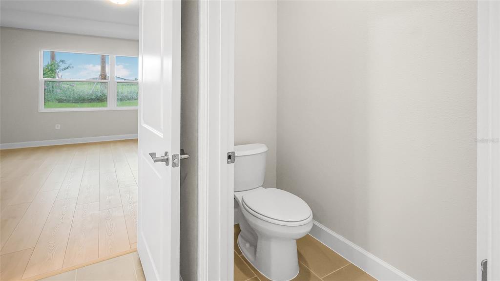 1620 Bellagio Loop Tavares, FL 32778 - Photo 45 of 81 a white toilet sitting next to a window