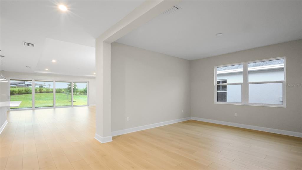 1620 Bellagio Loop Tavares, FL 32778 - Photo 8 of 81 an empty room with yard and outdoor view