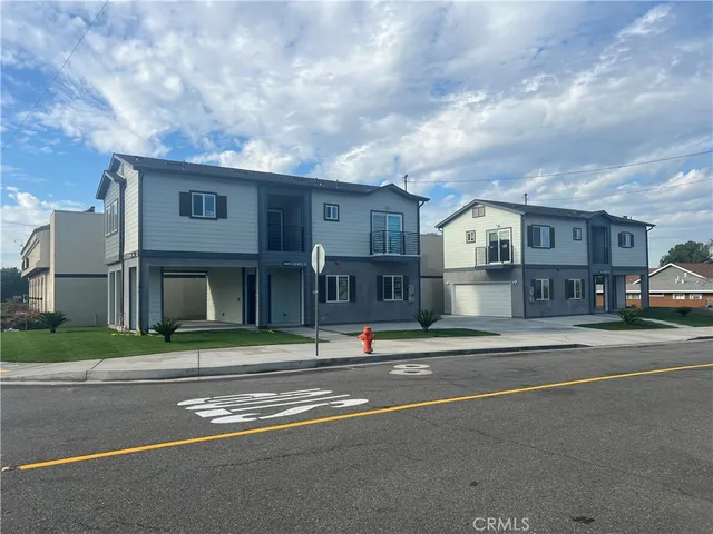a view of city street with a house