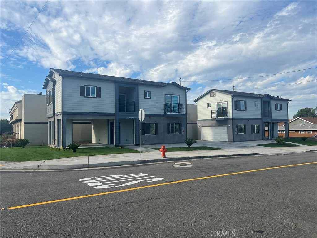 a view of city street with a house