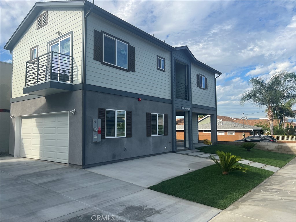 142 North Hewes Orange, CA 92869 - Photo 2 of 11 a front view of a house with garden