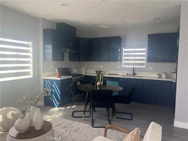 a kitchen with a sink cabinets and window