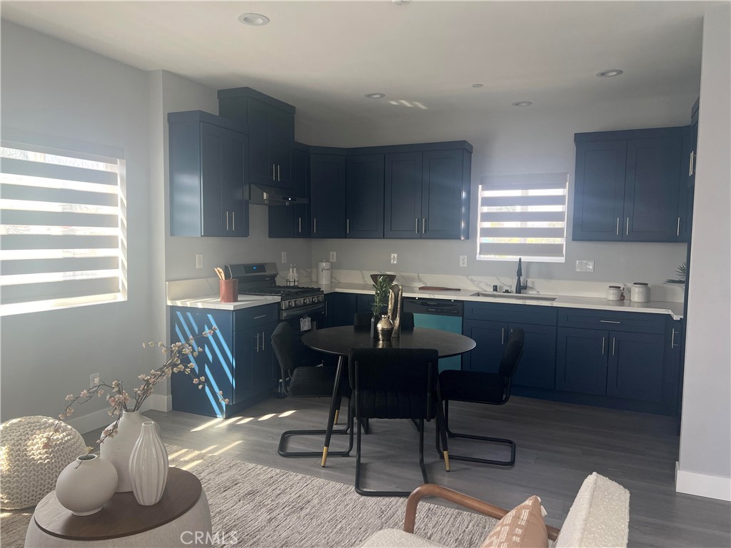 142 North Hewes Orange, CA 92869 - Photo 5 of 11 a kitchen with a sink cabinets and window