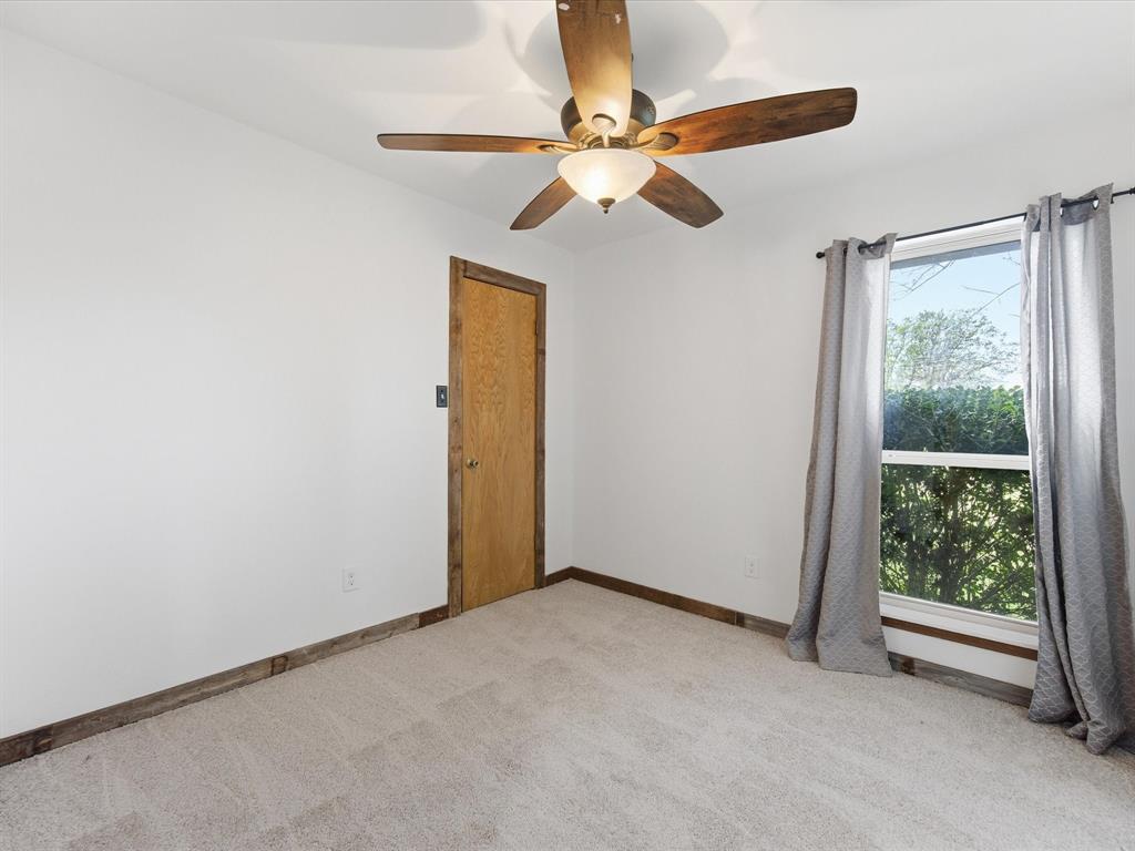 116 County Road 1559 Alba, TX 75410 - Photo 20 of 40 a view of an empty room with a window