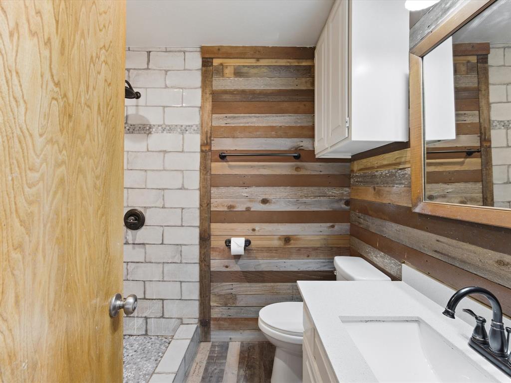 116 County Road 1559 Alba, TX 75410 - Photo 24 of 40 a bathroom with a sink and a toilet