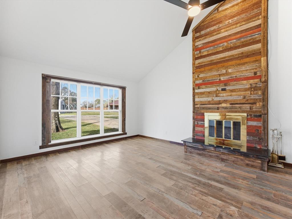 116 County Road 1559 Alba, TX 75410 - Photo 6 of 40 a view of a room with wooden floor and a large window