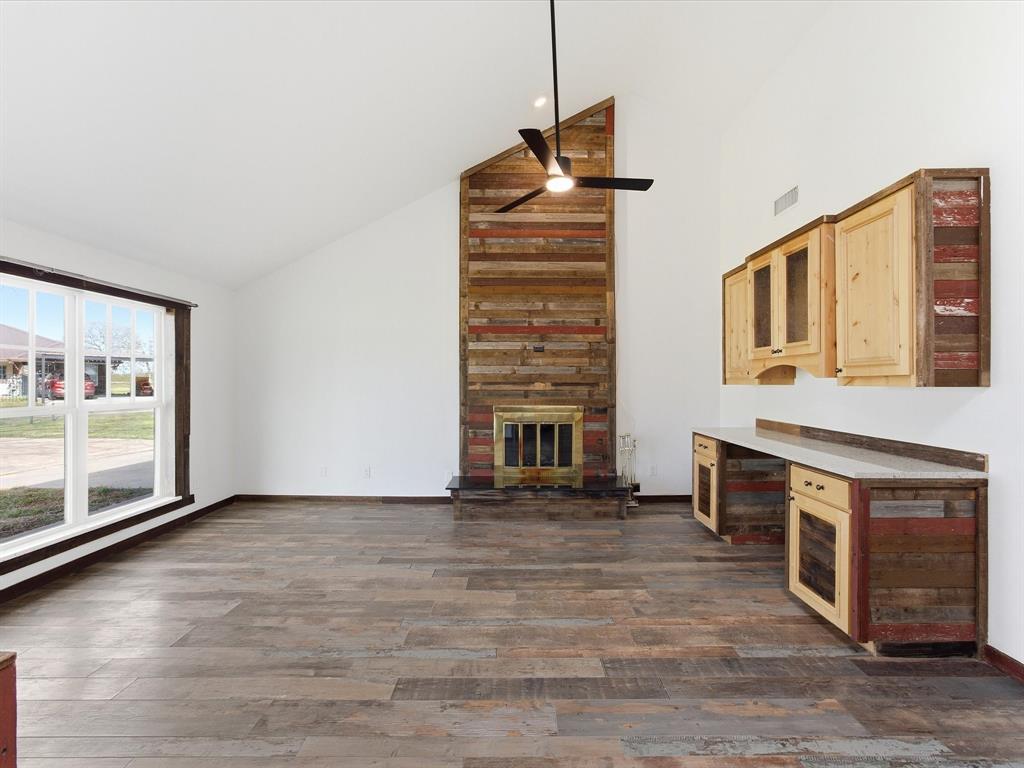 116 County Road 1559 Alba, TX 75410 - Photo 7 of 40 a view of an empty room with a fireplace and a window