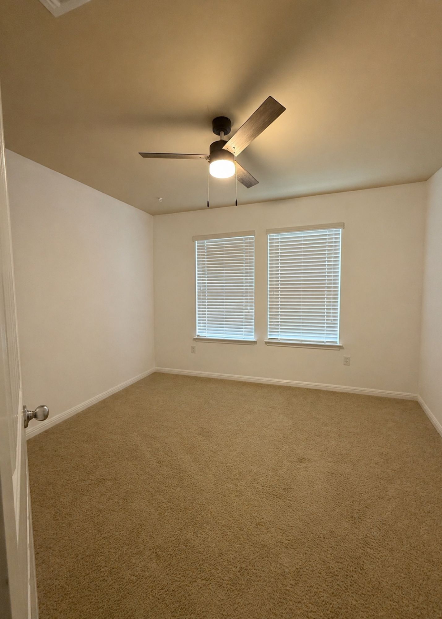 1529 Hamiltons Way Leander, TX 78641 - Photo 12 of 15 an empty room with a empty space and windows