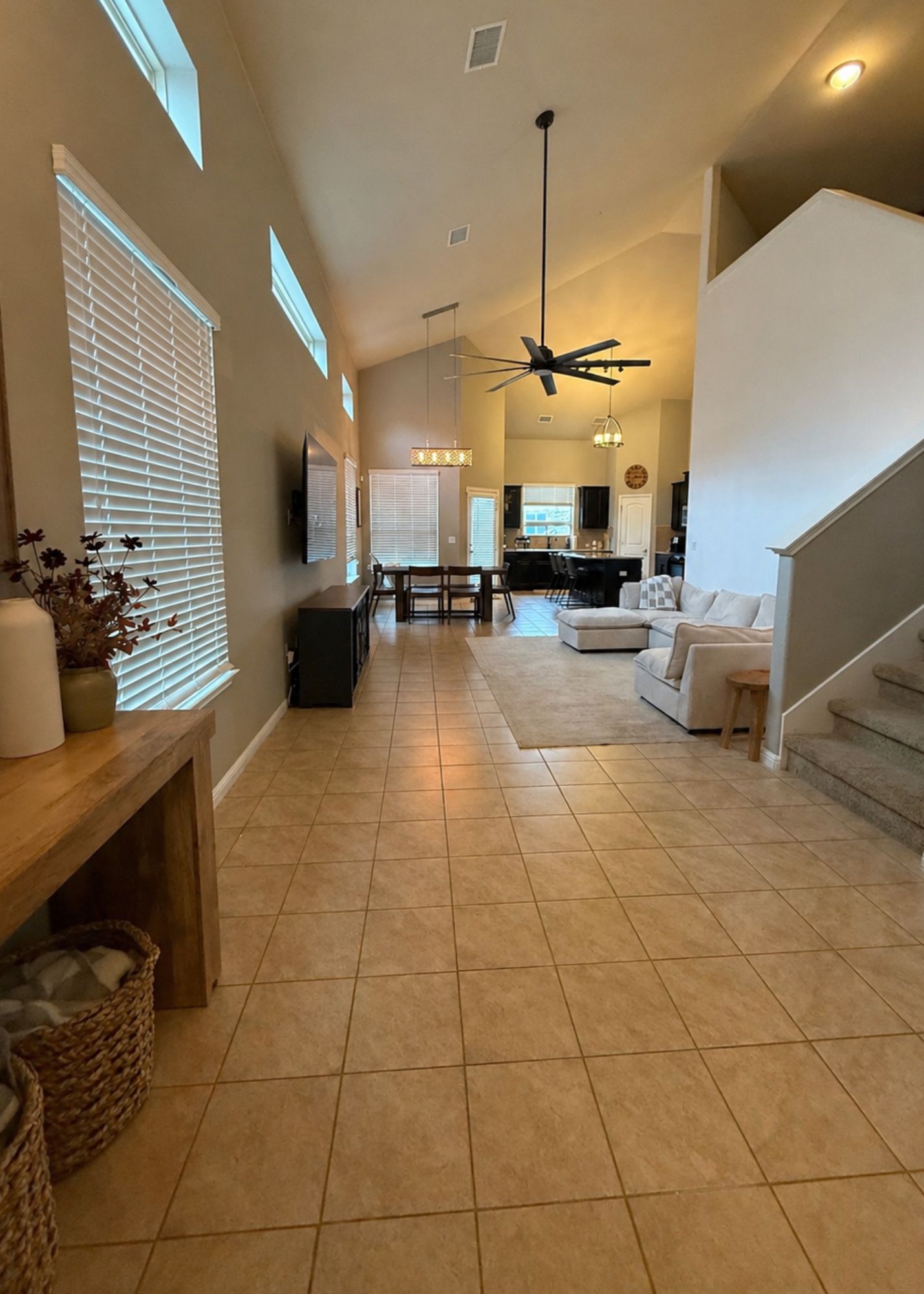 1529 Hamiltons Way Leander, TX 78641 - Photo 2 of 15 a living room with couches a flat screen tv and kitchen view