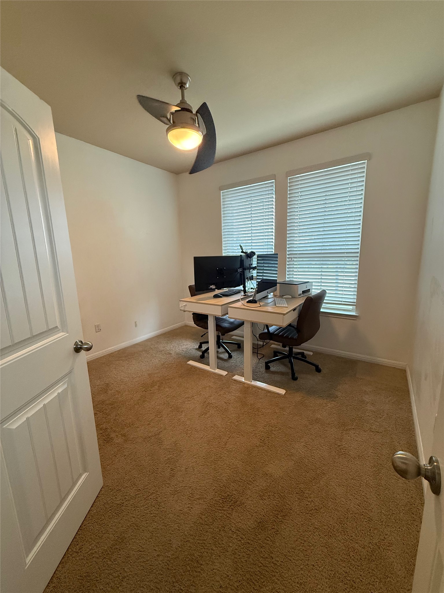 1529 Hamiltons Way Leander, TX 78641 - Photo 6 of 15 a view of a workspace with furniture and a window