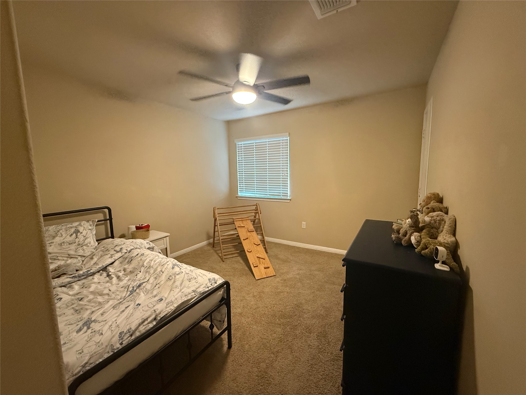 1529 Hamiltons Way Leander, TX 78641 - Photo 10 of 15 a bedroom with a bed and ceiling fan